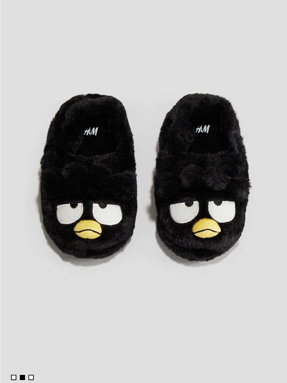 Badtz-Maru 
H&M Black Plush Kids Slip-On Character Slippers with Yellow Beak